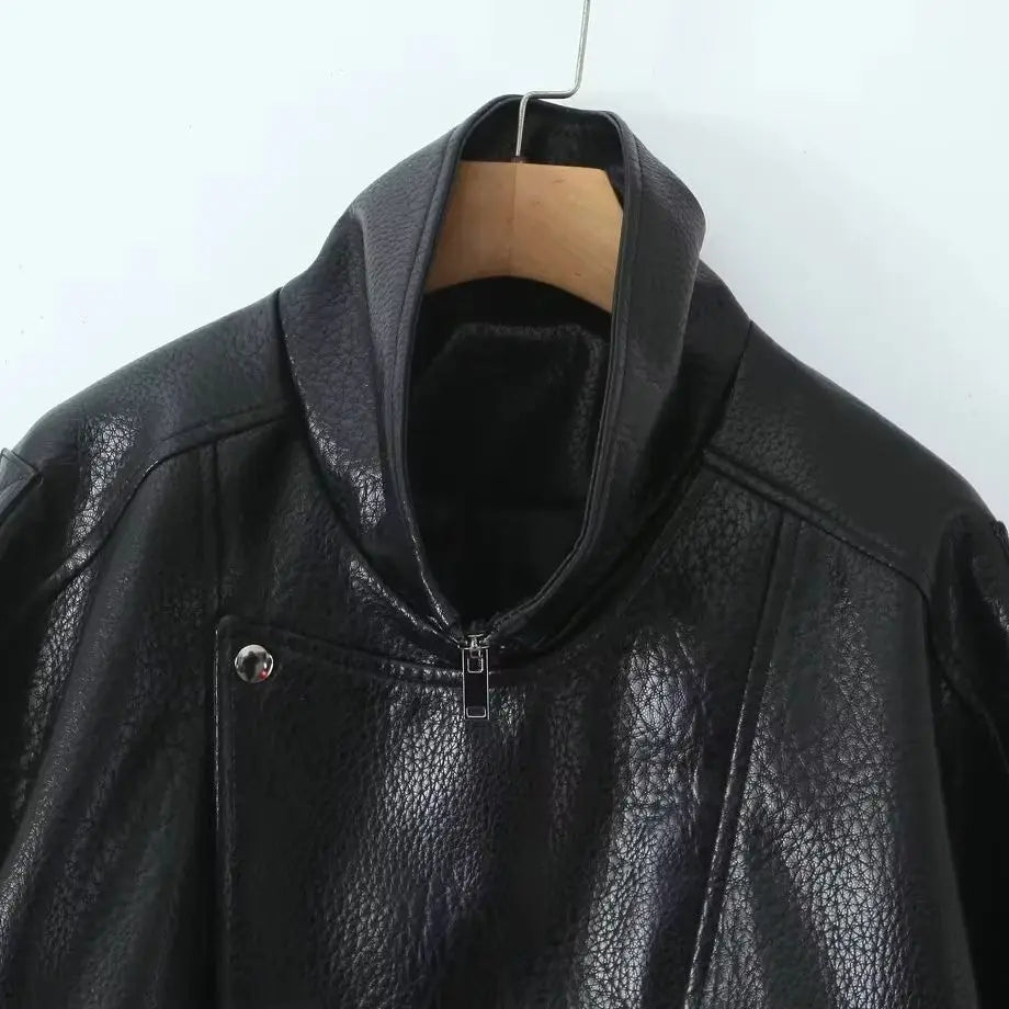 Veste courte effet cuir à ceinture