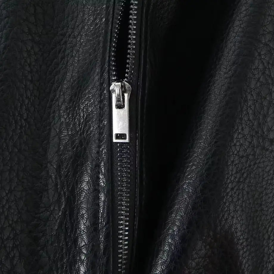 Veste courte effet cuir à ceinture