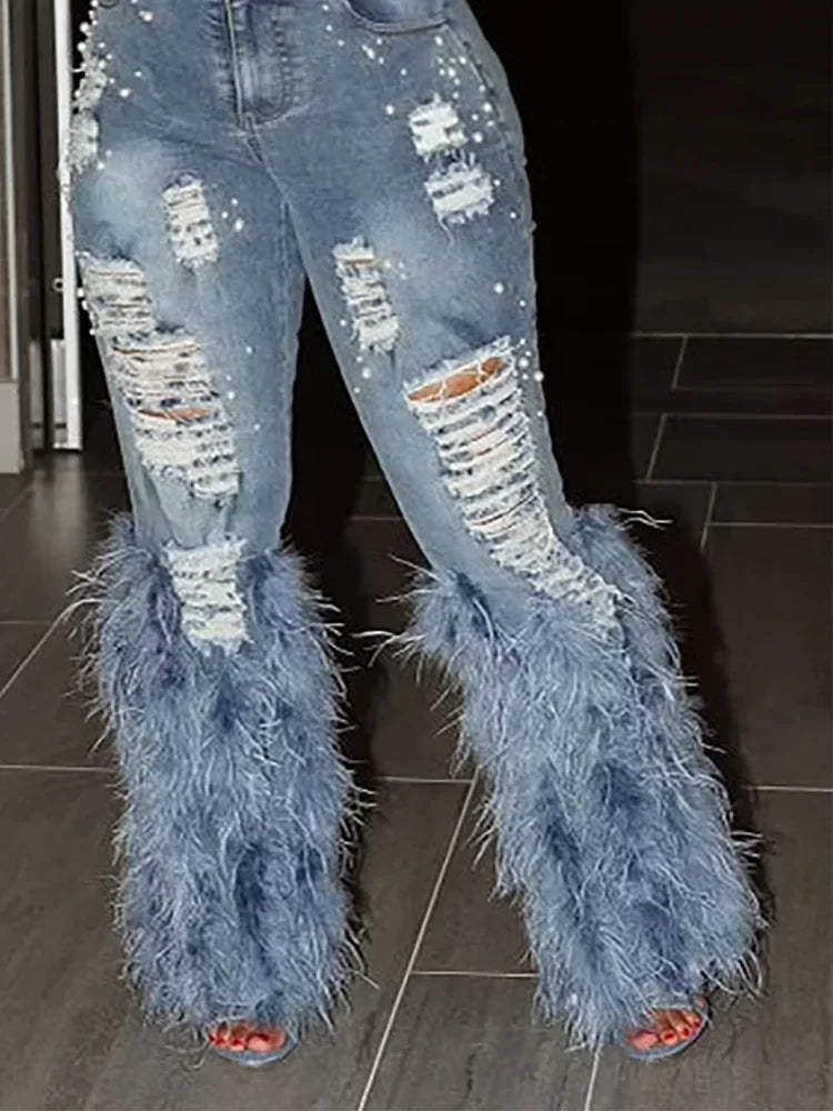 Jean à découpes et plumes